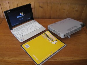 The yellow notebook shows you how compact my Acer netbook and Casio data projector are.  Everything fits into a backpack.